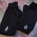 Black fingerless mittens with octopus charms by Whitaker Knits