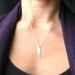 BOLT- sterling silver and brass charm necklace
