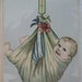RESERVED for JANET - Do Not Buy----------Smiling Baby Hanging From a Scale - early 1900's