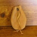 Honey deerskin Leather Drawstring Pouch with Marbled Black and Gold Clay Bead