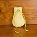 FREE SHIPPING - Cream Leather Drawstring Pouch with Marbled Yellow Bead