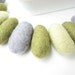 9 felted wool pebbles / beads (olive, gray, light green)