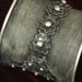 Tribal silver cuff bracelet -- flaired shape with braided wire and flower silver work -- nice patina FREE SHIPPING SALE