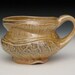 earthy shino orange and gold toned mug
