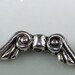 10 Small Scrolled Angel Wing Beads Silver 14mm (41103)