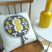 Pomegranate tree cushion in yellow on white linen