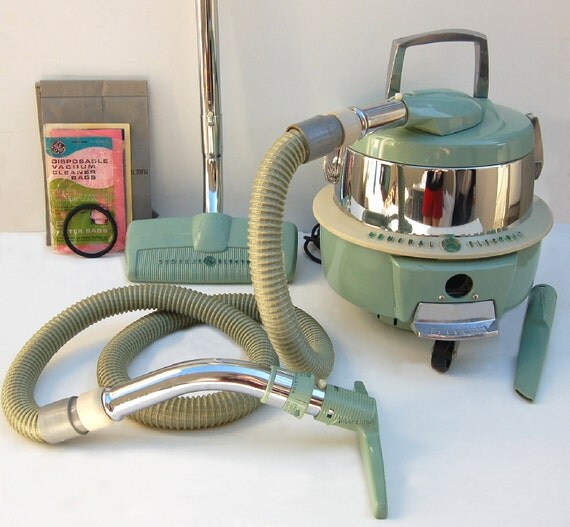 1950s General Electric canister swivel top vacuum cleaner with