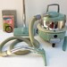 1950s General Electric canister swivel top vacuum cleaner with all attachments
