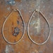 one at a time // 14k gold filled oblong hammered hoops