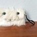 White Monster Pocket- Two Teal Eyes