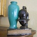 Porcelain Black Cat and vase on a book