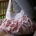 Pleated white and red floral purse