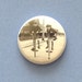 Pogo stick pinback button