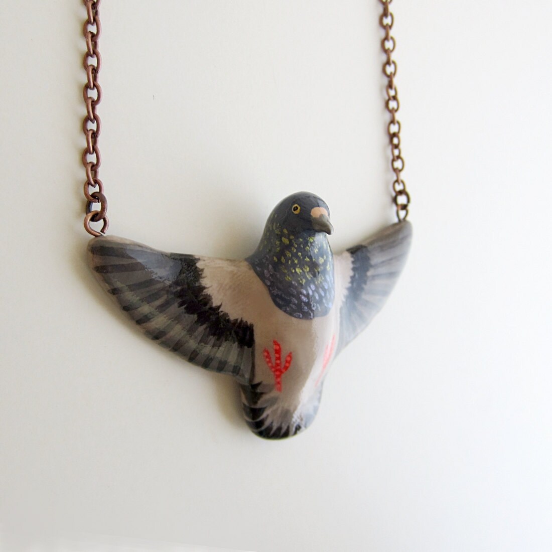 Items similar to pigeon necklace on Etsy