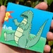 Godzilla vs. Unicorn wallet - Andrew Bargeron for Tinymeat