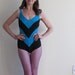 disaster relief. chevron stripe 1970 swimsuit in teal and black .small.medium .sale