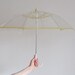 r e s e r v e d clear plastic bubble umbrella . 1950 parasol . yellow trim and flowers .sale