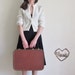hard brown suitcase . JC Higgins 1950 luggage .medium size