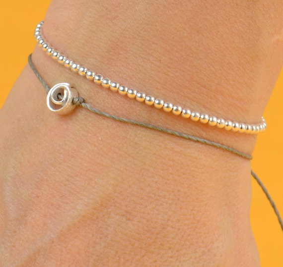 Spiral charm bracelet by zzaval on Etsy