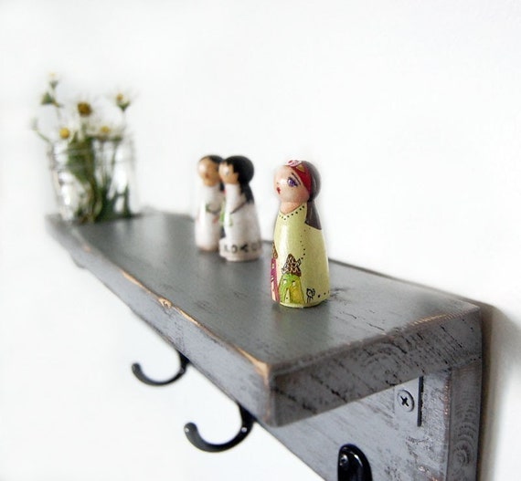 primitive cottage style wooden shelf with hooks and vase