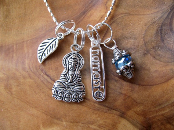 Items similar to Namaste Buddha Charm Necklace with Leaf and Turquoise ...