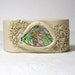 Creamy-white leather bracelet cuff with abalone shell.