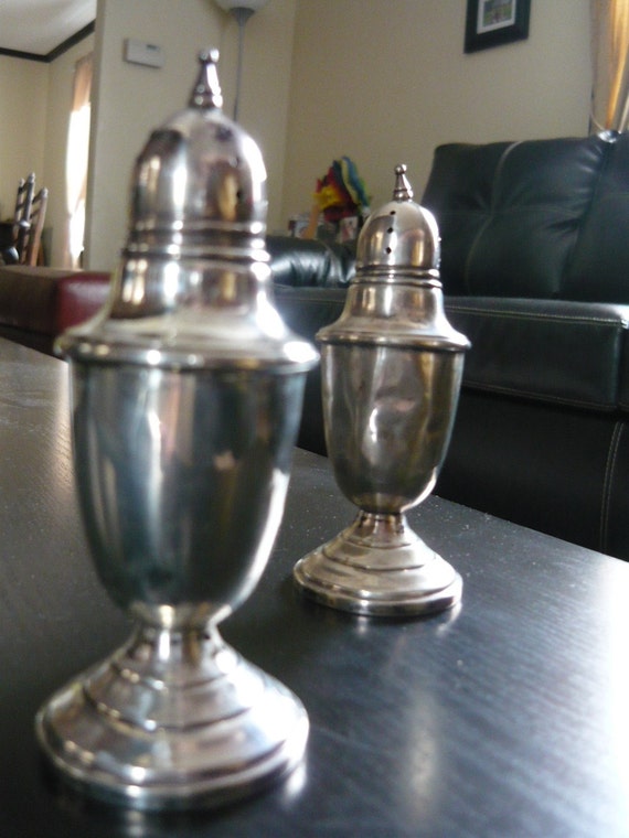 Elegant Salt and Pepper Shakers are stamped Crown Sterling