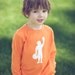 Football Player Long Sleeved Nostalgic Graphic Tee in Orange with White