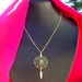Dream catcher necklace in gold with turquoise and 1-inch dream web