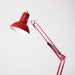 anglepoise style red desk lamp