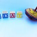 Vintage spinning top toy. Metal tin spinner Idle Hour toy. Cars, airplanes and trains.