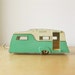 Vintage 1960s Collectible Retro Diecast Dinky Caravan Camper RV Trailer in Turquoise and Cream for Summer Camping Vacation.