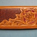 1970's flower tooled leather wallet. clutch purse