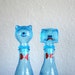 old pair of blue cat and dog wine decanters