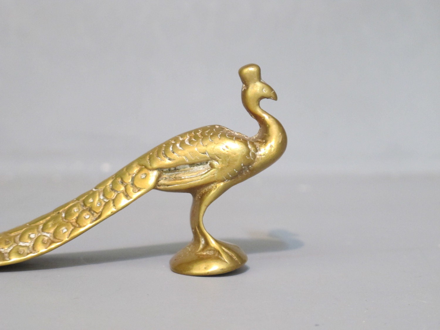 miniature peacock figurine