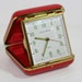 Travel alarm clock in red case