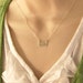 Sterling silver love word charm necklace