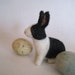 A bunny in black and white, needle felted animal