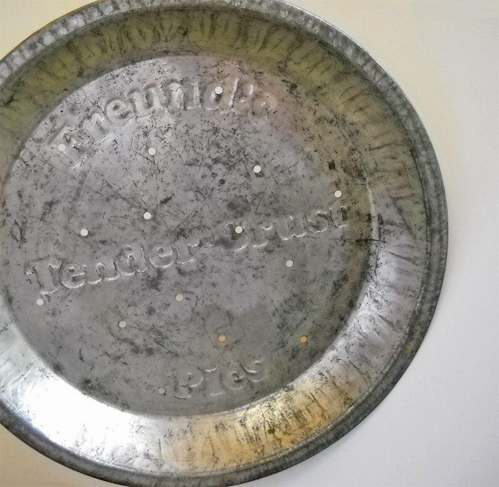old rustic tin pie pan or plate Freund Baking by milkglassandmetal