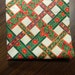 Fabric Destash. Ivory Background with Red and Green Ribbon Screen Print with Gold Outlines. 2510