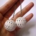 Nella Fantasia - White worked metal sphere in gunmetal long earrings