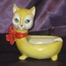 1930's Vintage German Porcelain Yellow Cat Ashtray with Big Green Eyes and a Red Bow