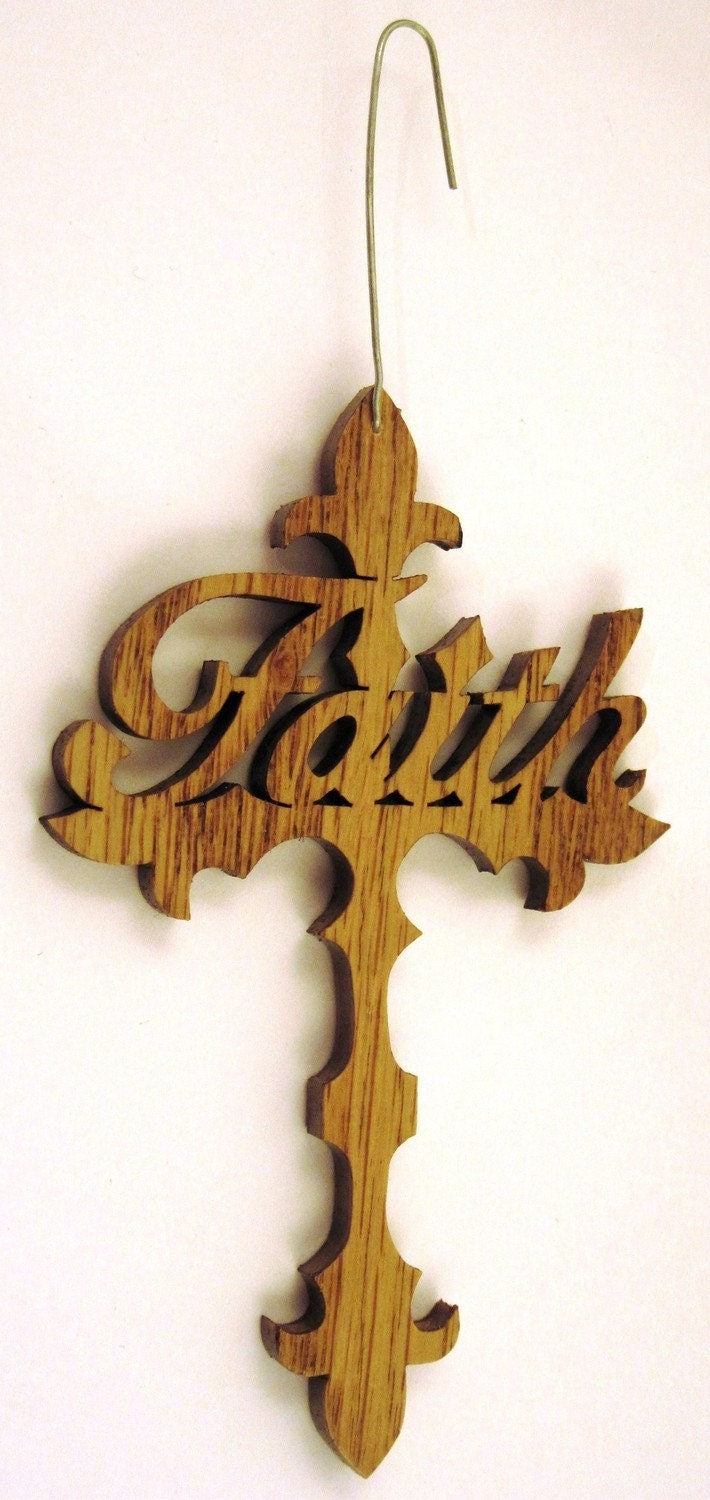 Scroll saw cut cross with the word faith on it