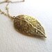 Golden filigree leaf charm necklace on long delicate 14k gold fill chain, vintage-inspired