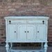 Refurbished Distressed Media Cabinet In Icy Blue
