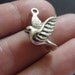 4 Dove charms ( double sided and 3D ) 20 x 15 x 6mm antique silver tone ( FREE combined shipping )