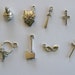 The Medieval Collection - 8 different antique silver tone charms