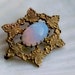 Lovely little opalite and gold tone leaf brooch