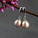Nessa- the large freshwater pearl earrings in a natural untreated mauve color set in solid sterling silver - not plated