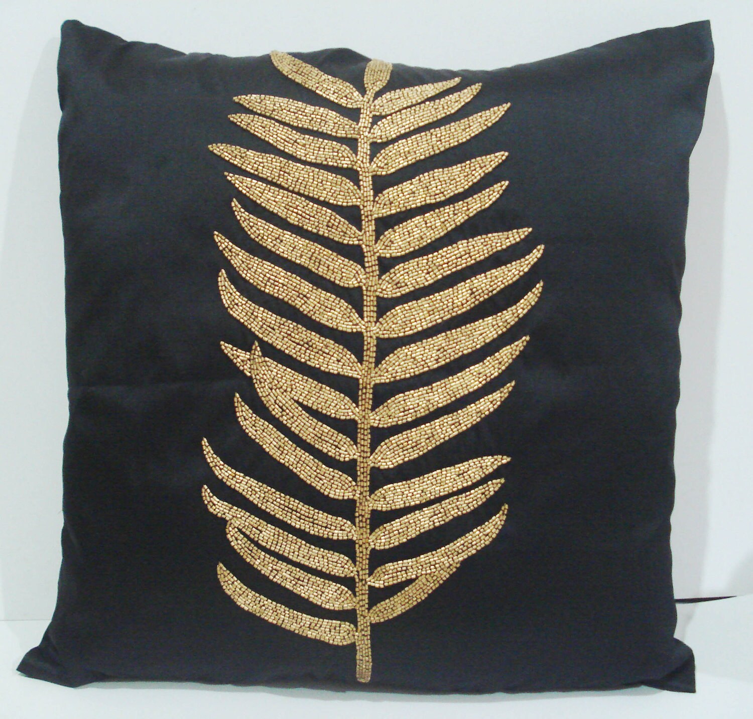 black pillowcasebotanical leaf designwith gold sequinsart
